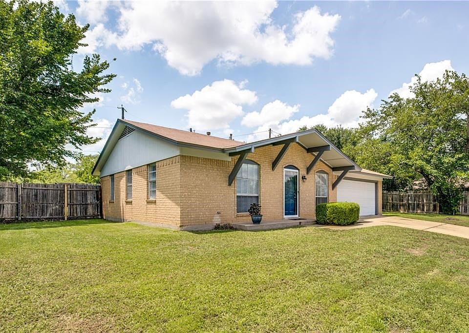 Charming three bedroom with two car garage.