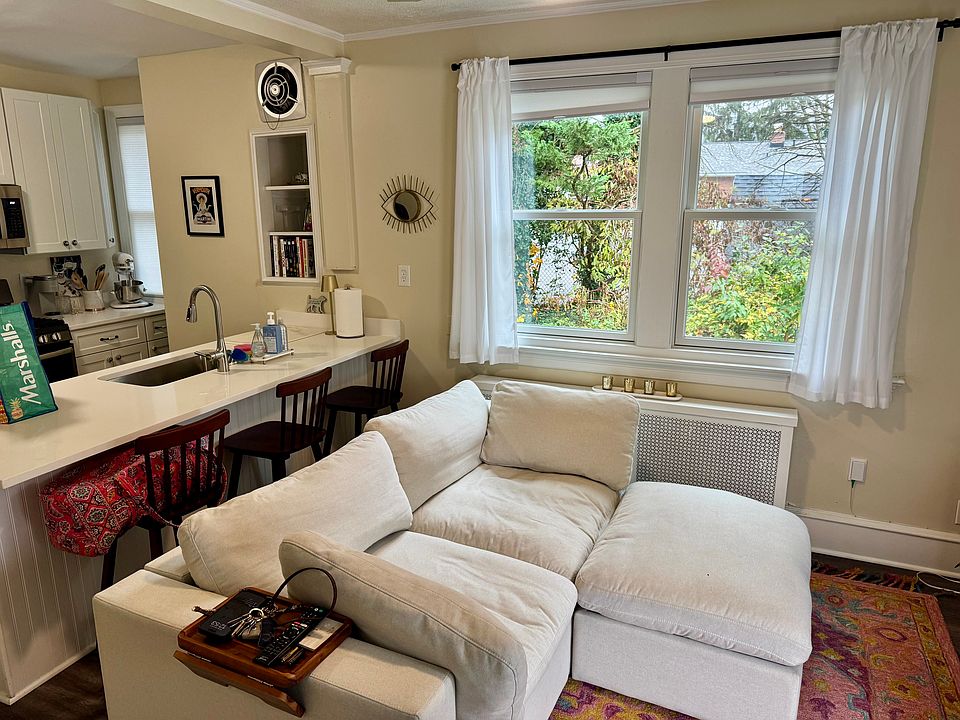 Living room with warm natural gas heat and natural light.