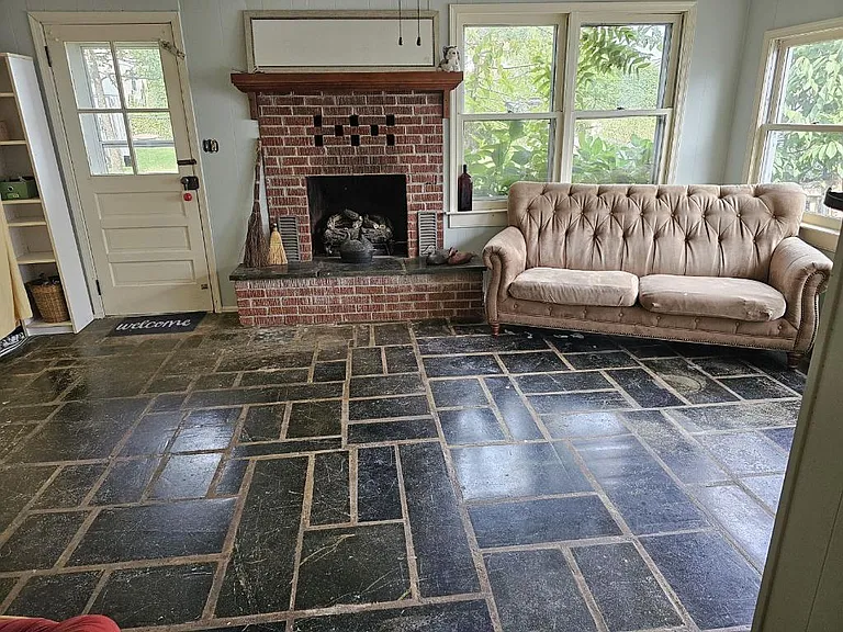 Sunroom with soapstone floors
and access to fenced yard