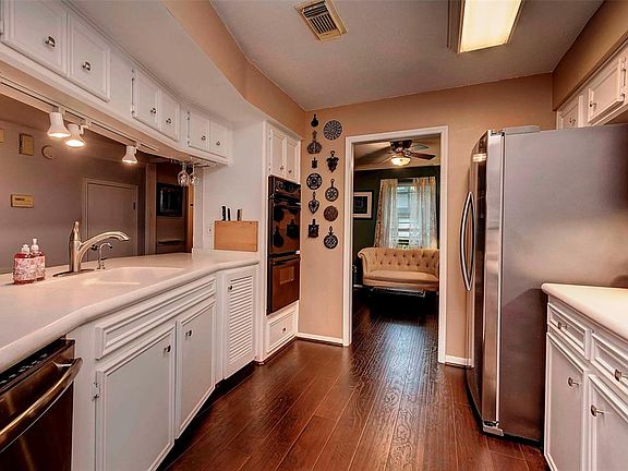 The kitchen has a new dishwasher, recent M/W, replaced counters, tile back-splash, replaced lighting, replaced sink fixtures, pa