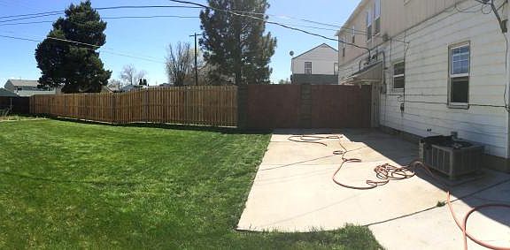 Full fenced backyard with patio