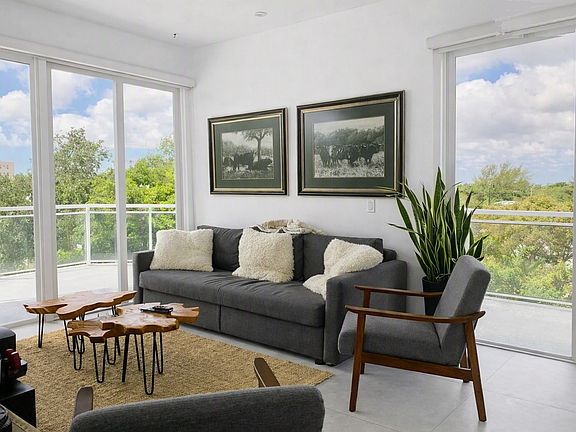 two sets of sliding impact doors in living dining room, corner unit, penthouse level