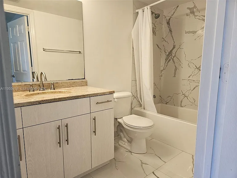5011 Wiles Rd #306 — Photo 8