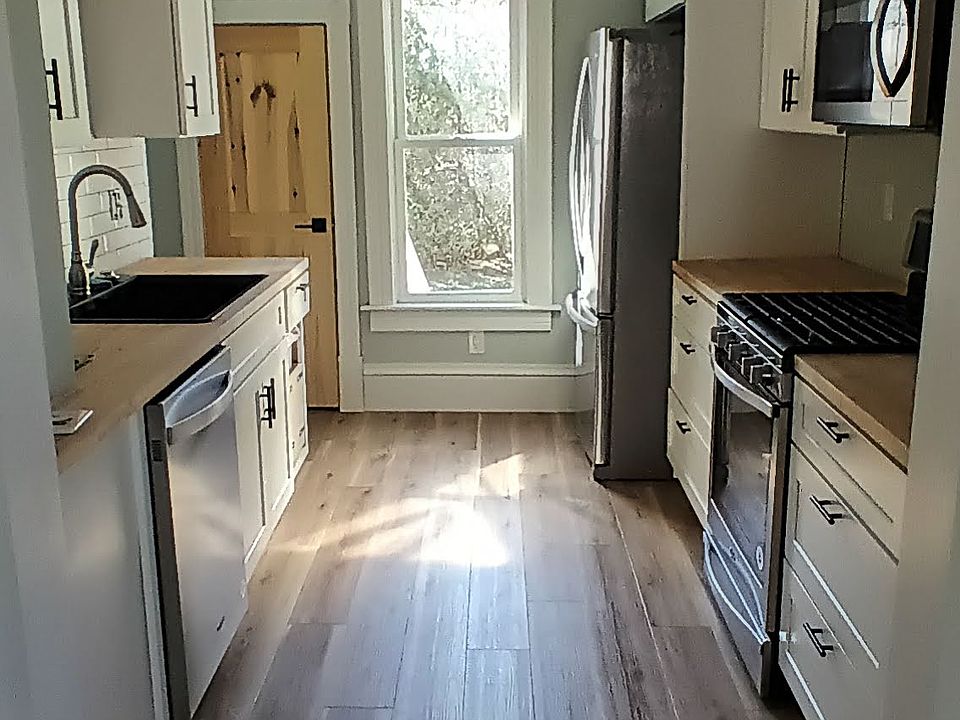 Butcher block counters, new stainless appliances, gas stove, dishwasher and garbage disposal, huge deep sink.