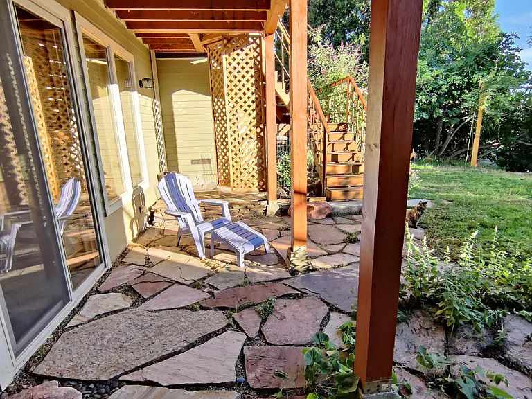 Beautiful flagstone patio with view of large lush yard