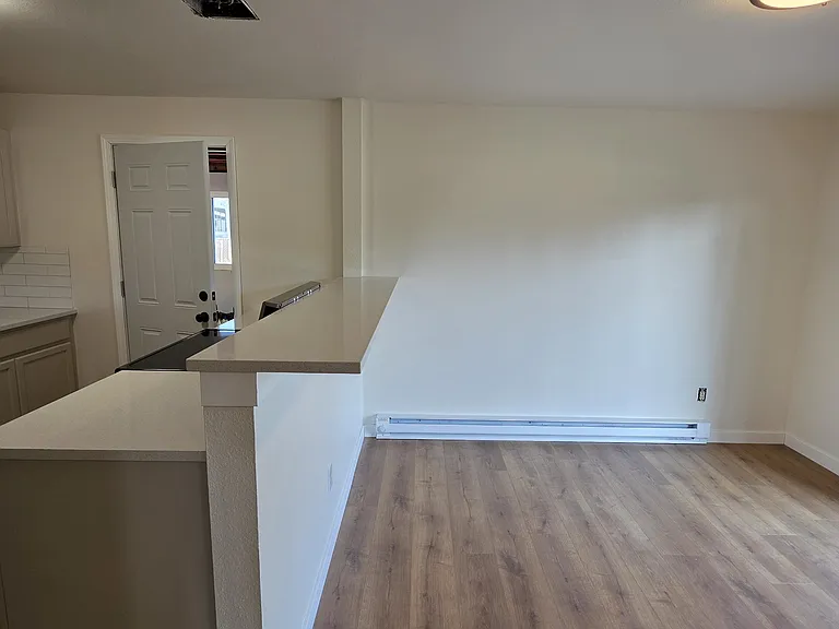 A view of the breakfast bar off of the kitchen