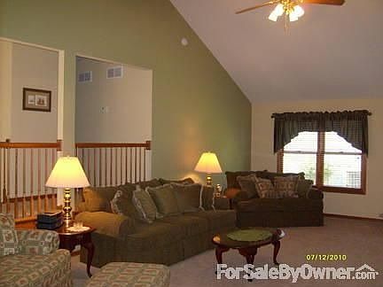 Living Room with vaulted ceiling : Spacious area can be formal or casual. Brick fireplace, gas log, 