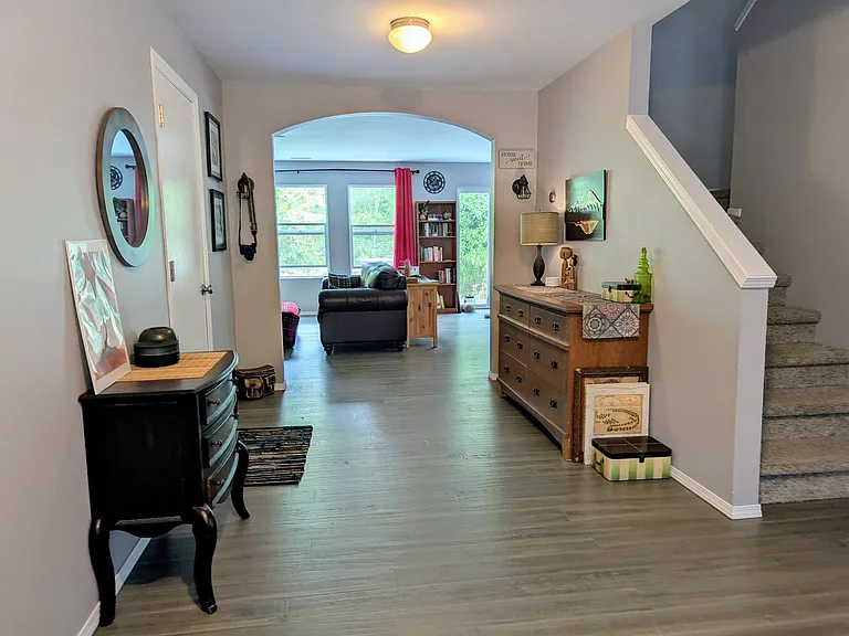 12' x 18' Foyer leads to Living Room straight ahead, Office to right, stairs, and Garage to the left.