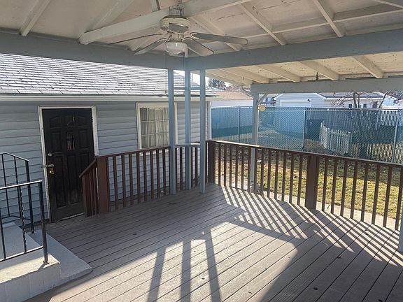 Covered Back Deck off of Kitchen - Entrance to garage.
