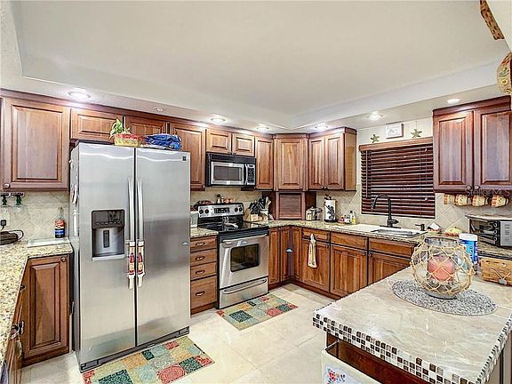 4th image of 7600 Sun Island Dr S APT 105