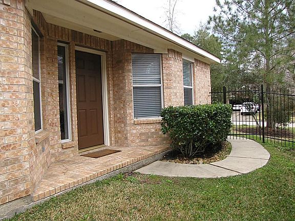 Feel secure with a front door located to the side of the house beyond a locked wrought iron fence.