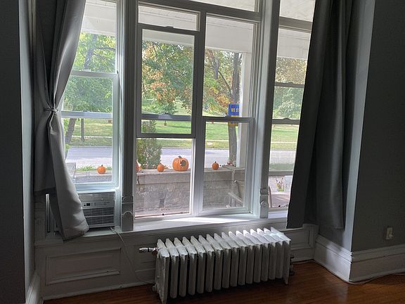 Windows look out onto the porch and park