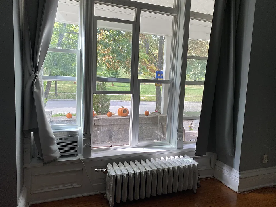 Windows look out onto the porch and park