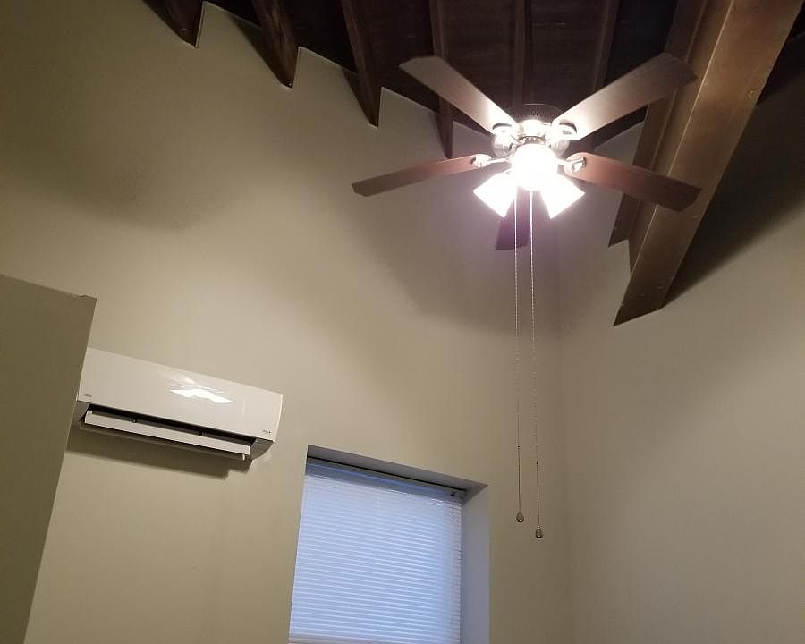 Exposed beams in bedroom