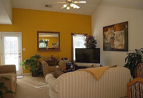 Living room w/ vaulted ceiling