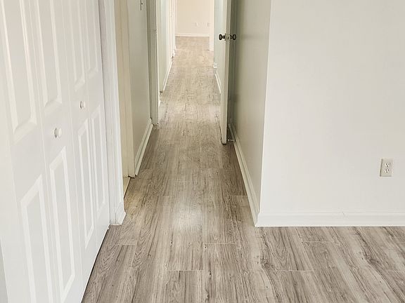 Primary Bedroom, View of rest of the home from corner of the room; gorgeous hardwood floors throughout