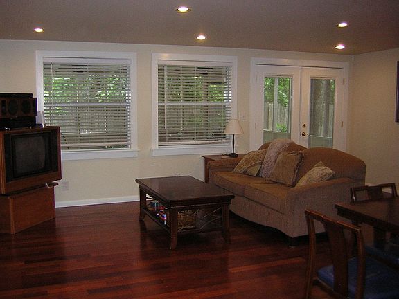Family Room with hardwood floors and recessed lights. Large windows & Fr Doors