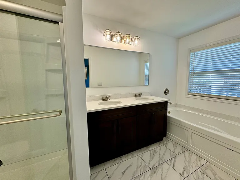 Master Bathroom with stand in shower, dual sink & soaking tub
