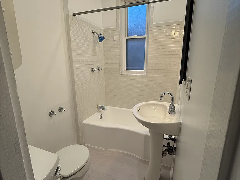 2nd Floor Bathroom (situated in between the 2 back bedrooms) boasts a pedestal sink, shower/tub and new toilet. Again, making this house convenient to share w 2 people, since the back two bedrooms make for a private nook, close to the bathroom