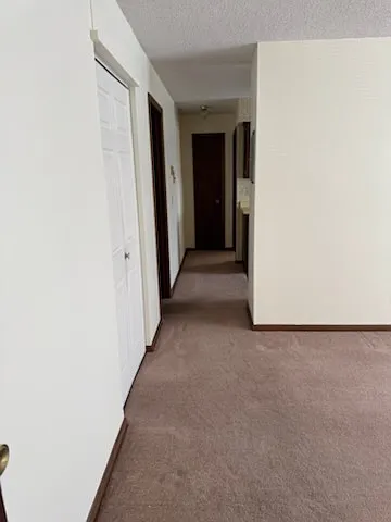 Hallway with large walk-closet