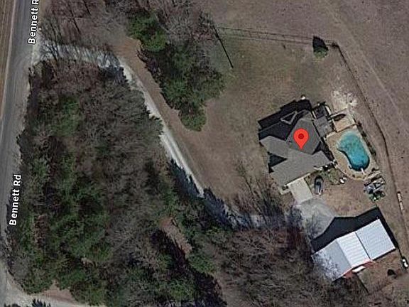 Google Earth photo redlining the approximate 1.77 acres which features a large pool, covered patio, gazebo and spacious shop!