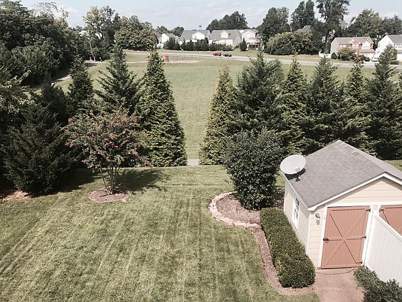 Beautiful backyard that lie adjacent to large field with walking path. Outside shed for extra storage.