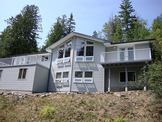 front of home tucked into hillside