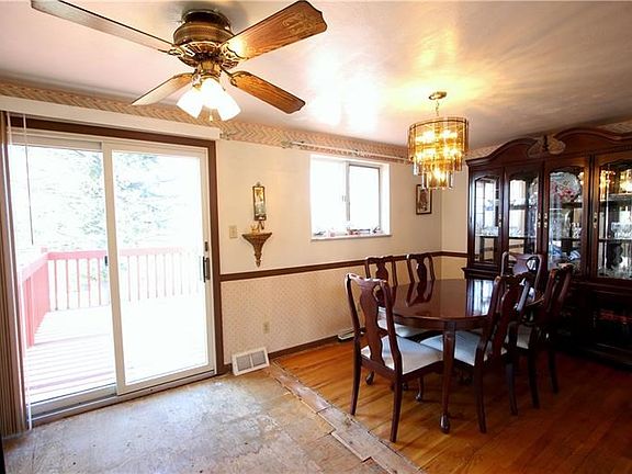 Beautiful Sliding Glass Door from Dining Room onto 18x13 Wood Deck overlooking Huge Back Yard! Lots of Natural Light flowing thr