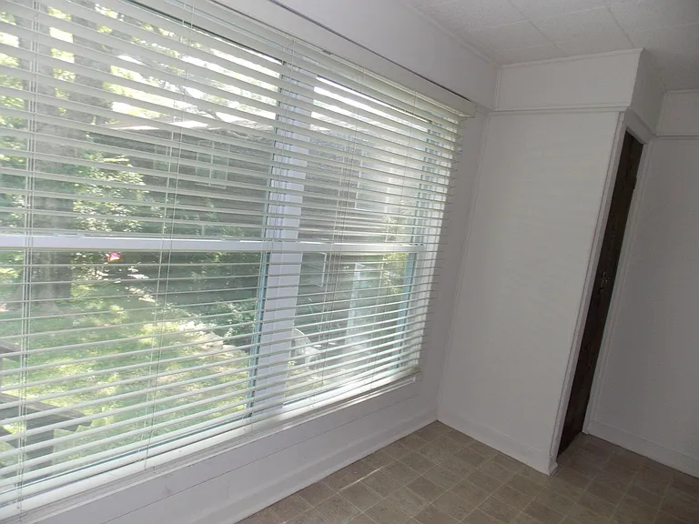 Mudroom at side door entry with coat closet