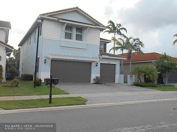 LOCATED ON A QUIET STREET, THIS BEAUTIFUL HOME FEATURES ALL HURRICANE GLASS WINDOWS, DOORS AND GARAGE DOORS.