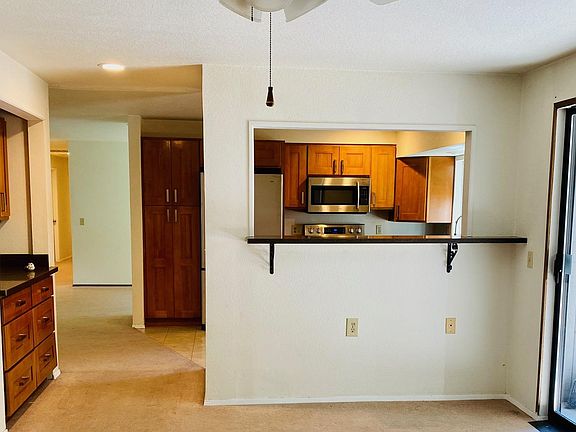 Dining and sitting areas behind kitchen