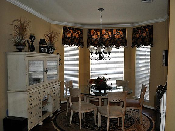 Breakfast room with hardwood flooring off kitchen.
