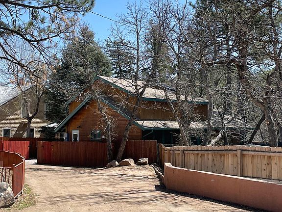 Directions to 1704 W Cheyenne Road: Access from Cheyenne Boulevard (not Cheyenne Road). On Cheyenne Boulevard, go past Sacred Grounds Cafe and turn left into the driveway marked 1702-1704 Cheyenne Road. This is the view if you are in the right place.