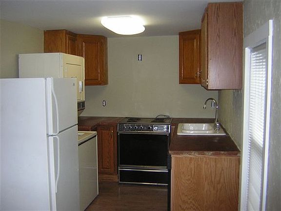 Kitchen with All Appliances & Concrete Counters