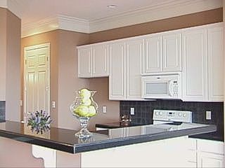 Kitchen with granite, butler's pantry and stainless appliances