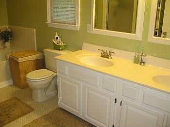 Remodeled bathroom, dual vanity, tile floors