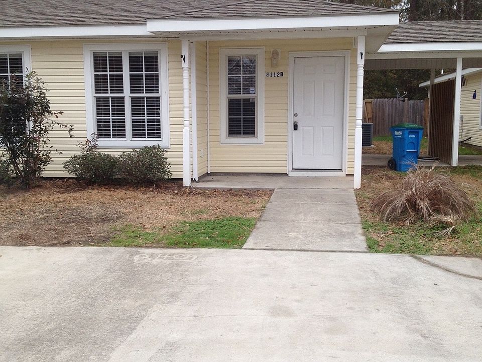 EXTERIOR FRONT AND SIDE PATIO