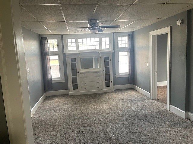 Spacious dining room/office area with built in credenza.