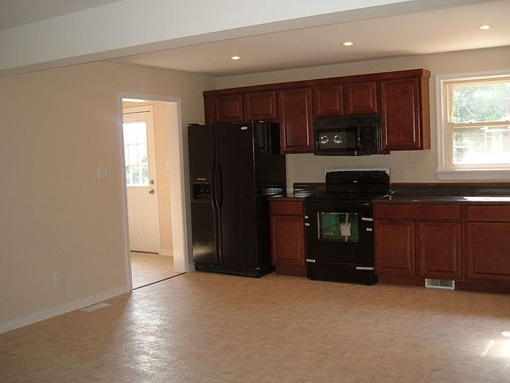 Side-by-side fridge, smooth-top stove, over-the-stove microwave, dishwasher 