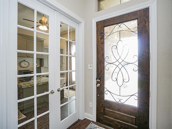 Formal entry with french doors to study