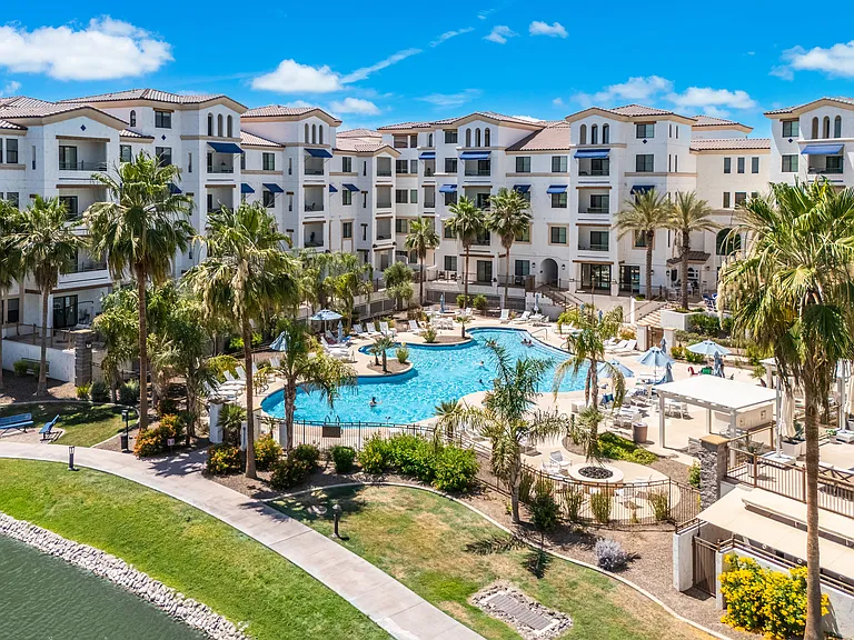 Resort-style pool, spa, and waterfront lounge areas.