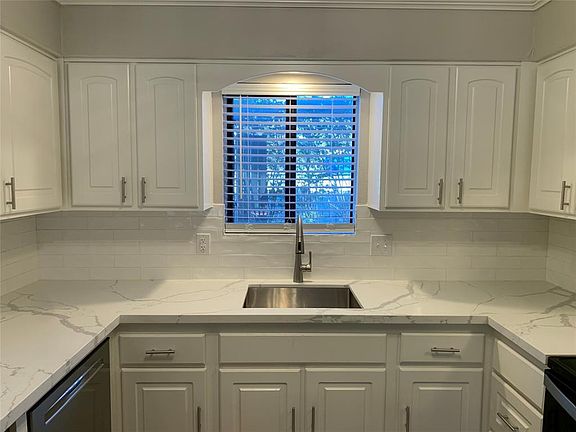 All new quartz countertops, dishwasher, neutral backsplash and stylish hardware.