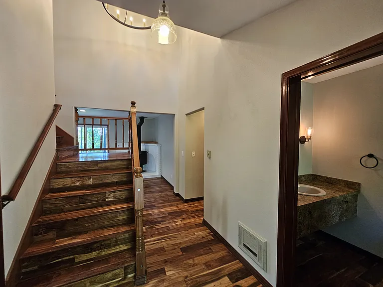 Entry way - Half bath on the right and laundry/utility room on the left.