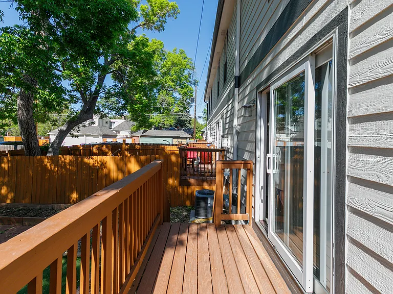 Enclosed backyard with deck