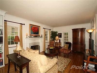 Character & grace envelope you in this charming living/family room. Rich hardwood floors, marble sur