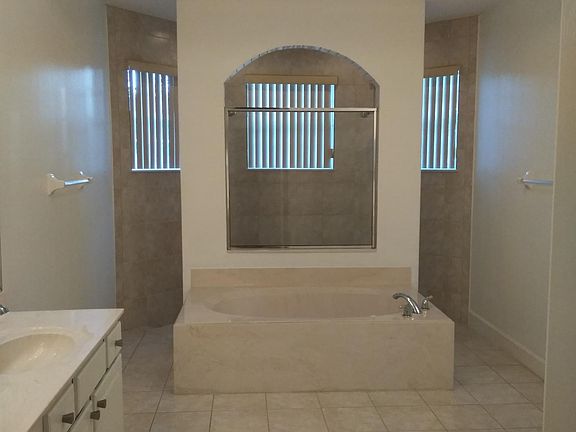 Master Bathroom - dual showers, his and hers vanities
