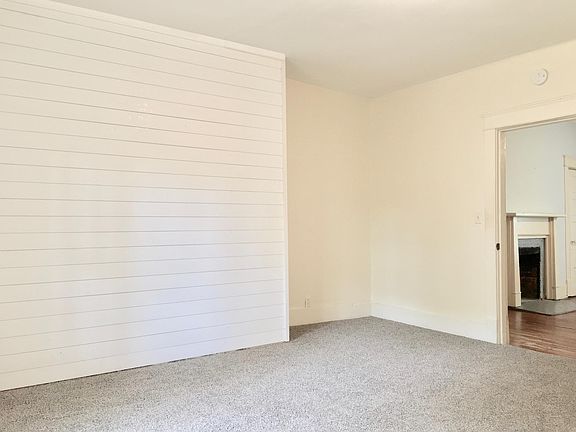 Bedroom 2 with NEW carpet and shiplap wall.