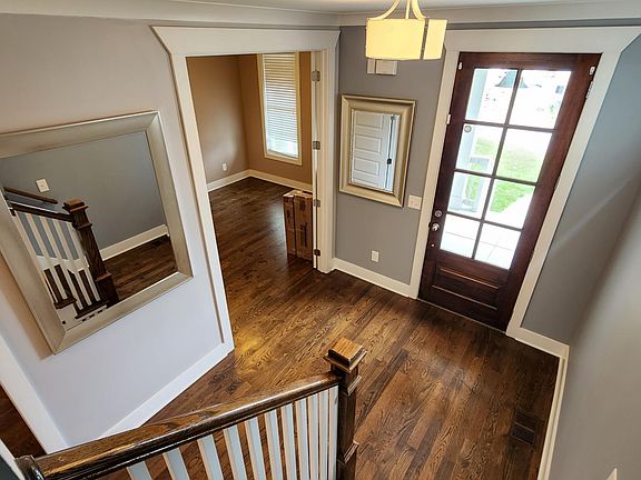Front door with view of downstairs bedroom
