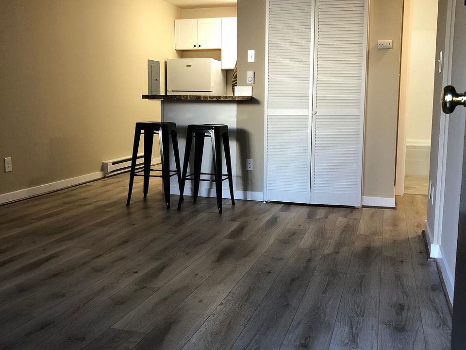 This is a ground floor level unit, with a North facing entryway and windows. This unit has been given a glow-up with a breakfast bar (in photo) a microwave, and dishwasher in the kitchen