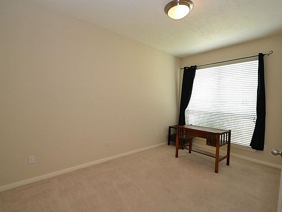 Double doors open to the study just to the right of the entry.